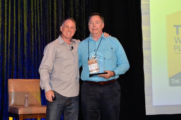Jay Smith presents the Home Solutions Member of the Year Award to Mike James, Metro Carpets.