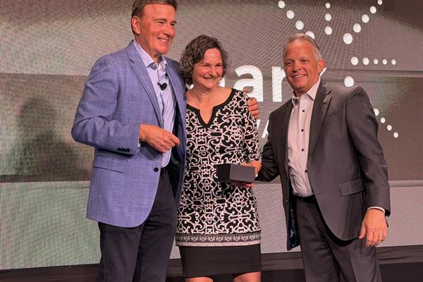 Dawn Martinelli with Fuse accepting her Service award