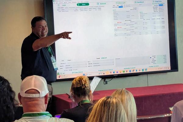 Chad Ogden, co-founder of QFloors, presenting at meeting