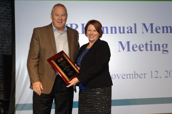 Milliken president Jim McCallum presented Susan Rich Farris with the Joseph j. Smrekar Memorial Award.