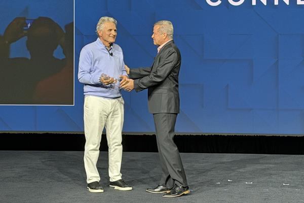 Charlie Dilks being inducted into the WFCA Hall of Fame with Scott Humphrey, CEO of the WFCA